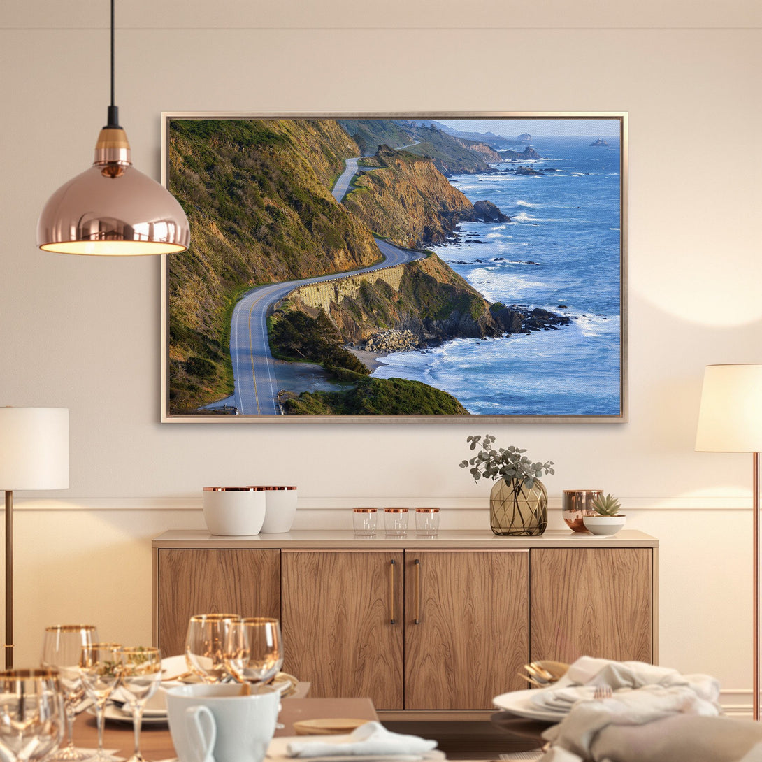 Framed Wall Art: Coastal highway Canvas Print in blue and green tones, perfect for a modern living room. Bring the beauty of nature indoors!