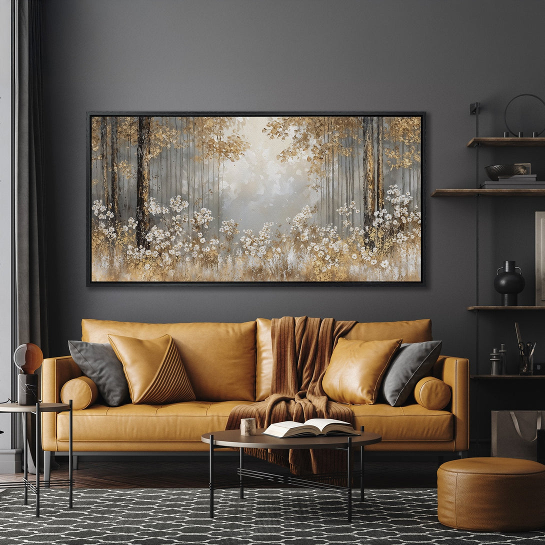 Framed Wall Art: Forest scene canvas print with gold and white accents, displayed in a modern interior with a warm, neutral color palette.