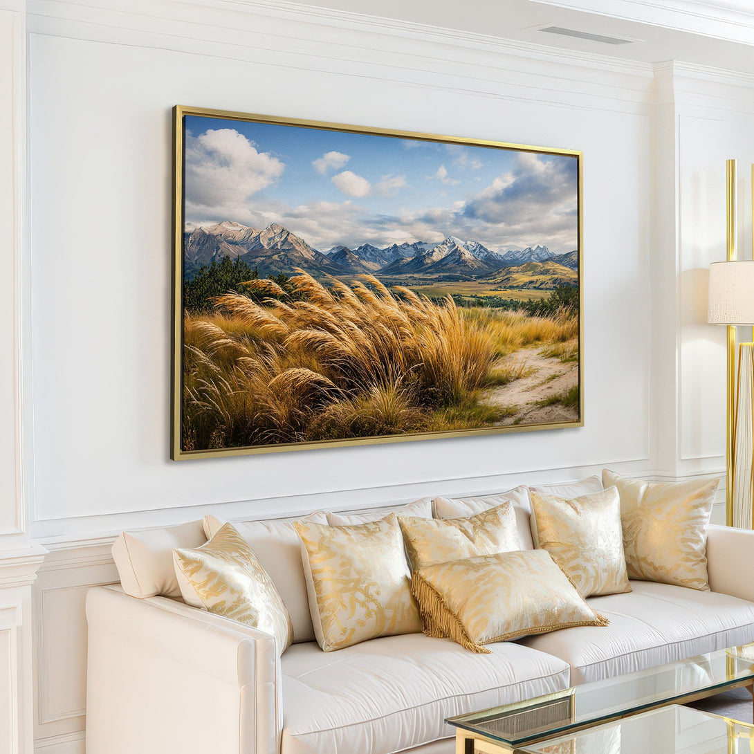Canvas Print: Mountain landscape art in a modern living room. Earthy tones and blue sky create a serene and inviting atmosphere.