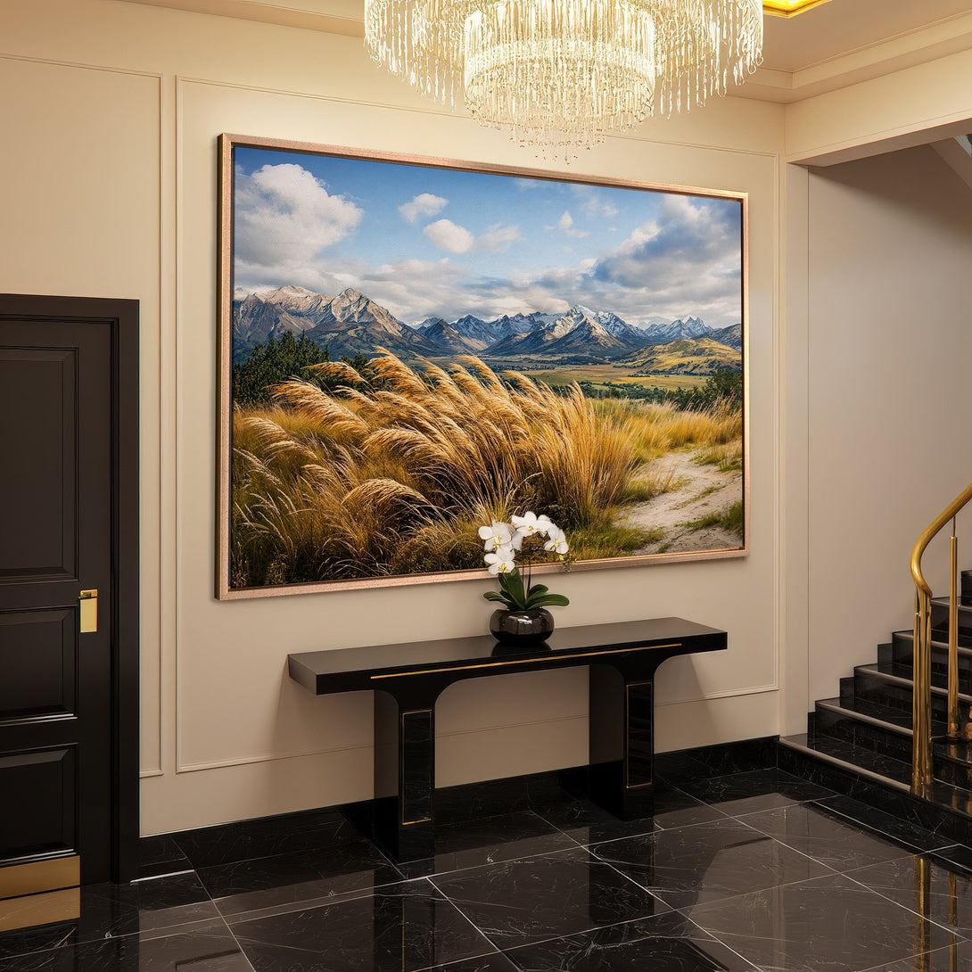 Framed Wall Art: Stunning landscape Canvas Print with mountain view in a modern interior. Earthy tones and blue sky create a serene atmosphere.