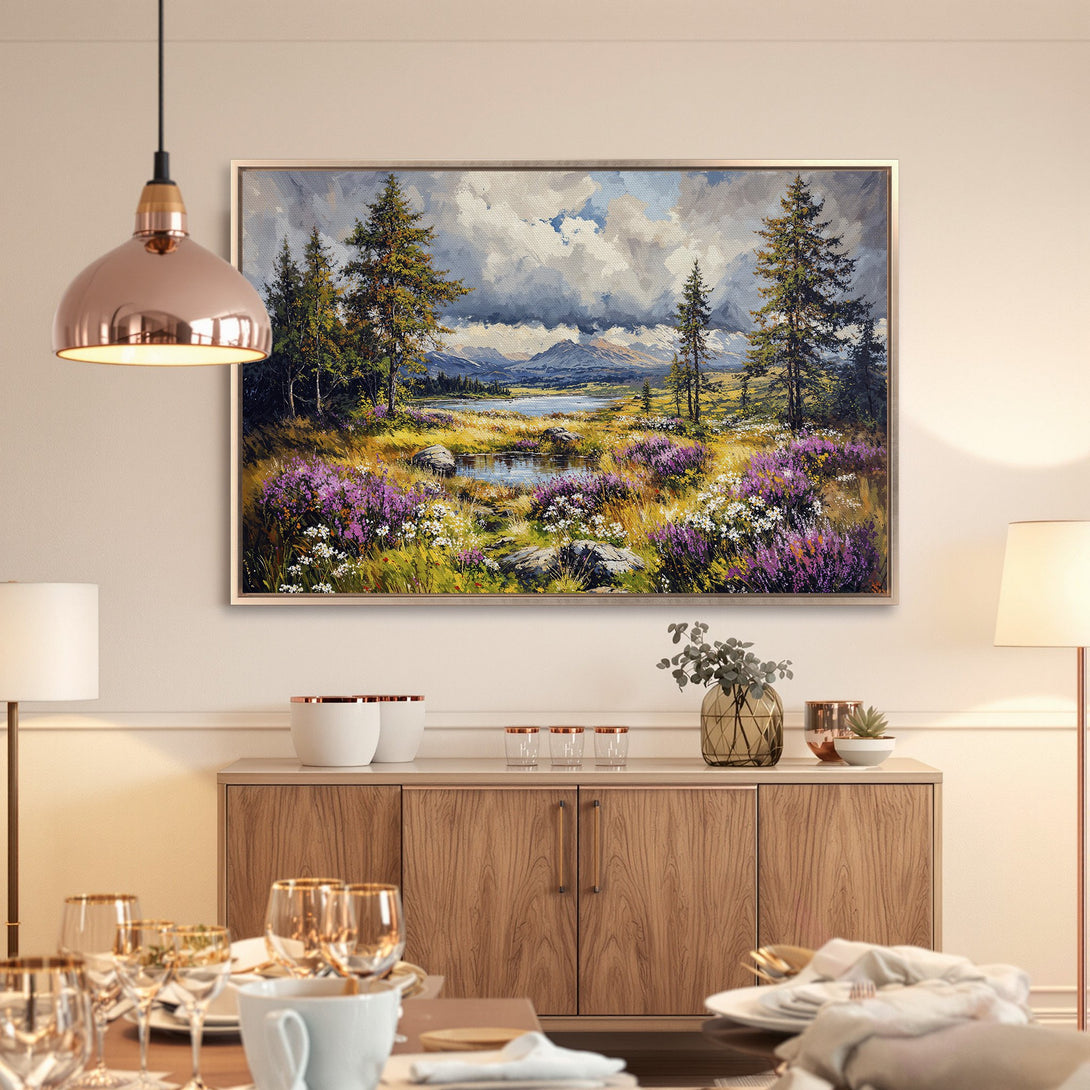 Framed Wall Art featuring a landscape painting with mountains, trees, and purple flowers. Earthy tones with pops of color create a serene and inviting atmosphere.