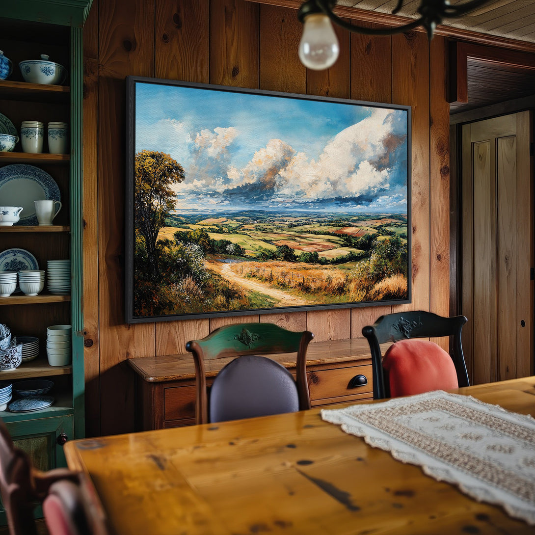Framed Wall Art: Landscape Canvas Print in a rustic dining room. Features a serene countryside scene with green, blue, and earth-toned hues.