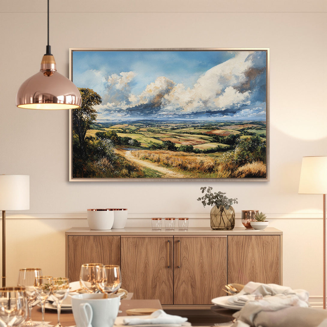 Framed Wall Art: Landscape Canvas Print in warm tones. Featuring a scenic countryside view with blue sky & clouds, perfect for home decor.