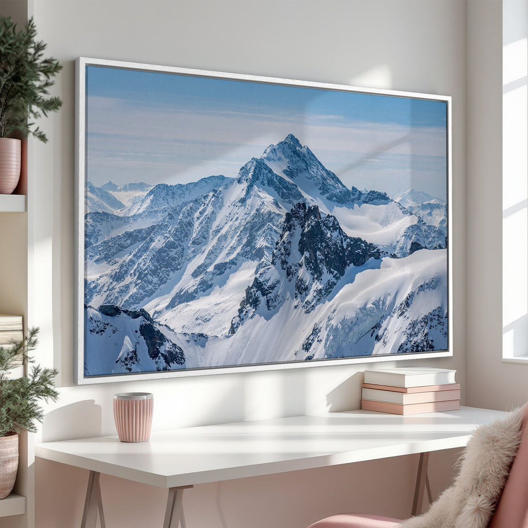 Framed Wall Art of a majestic mountain range in a cool blue and white palette. Bring the beauty of nature into your home with this stunning Canvas Print!