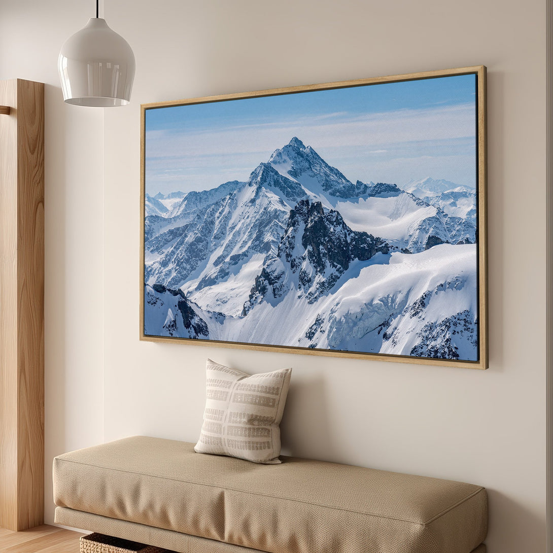 Framed Wall Art: Majestic mountain landscape canvas print in cool blue and white tones. Bring the beauty of nature into your home!
