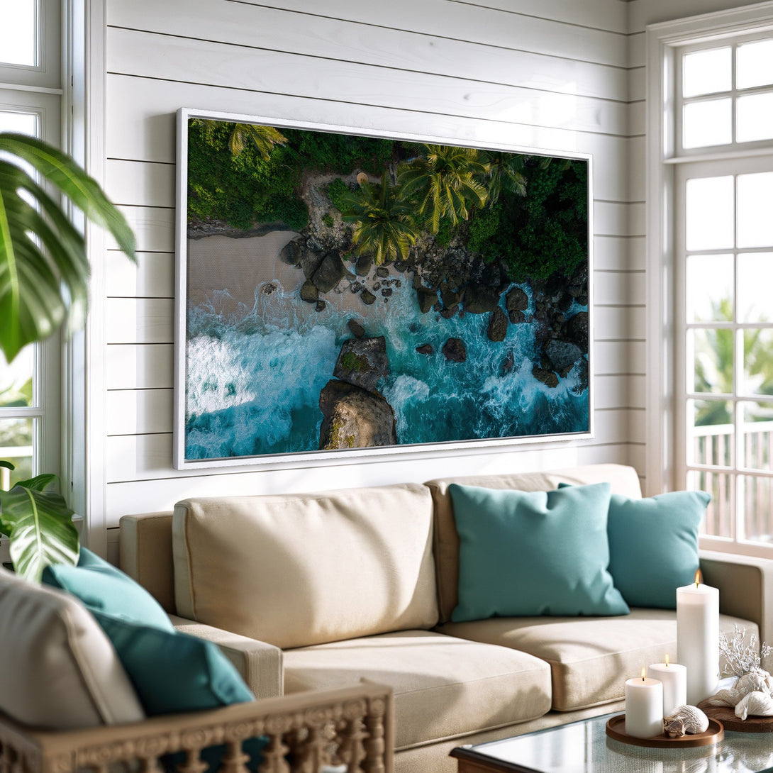 Framed Wall Art: Aerial view of a tropical beach with turquoise water and green palm trees. Coastal decor in a bright, airy interior.