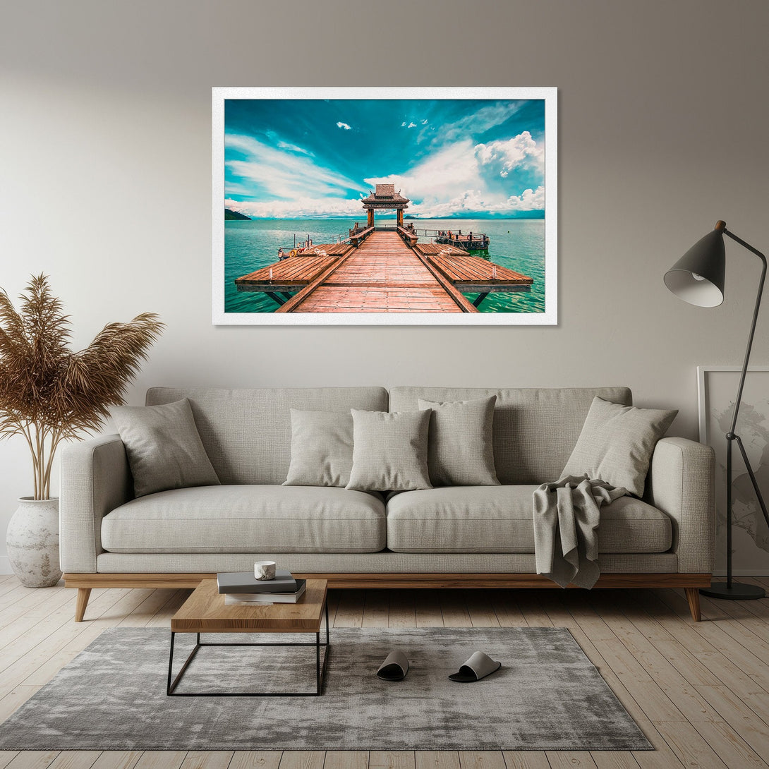 Framed Poster featuring a pier over turquoise water, capturing a serene landscape in a vibrant blue and brown palette. Perfect wall art!