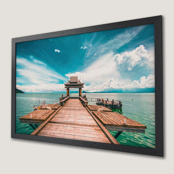 Framed Poster featuring a serene pier scene with turquoise water, a wooden dock, and a blue sky. Perfect wall art!