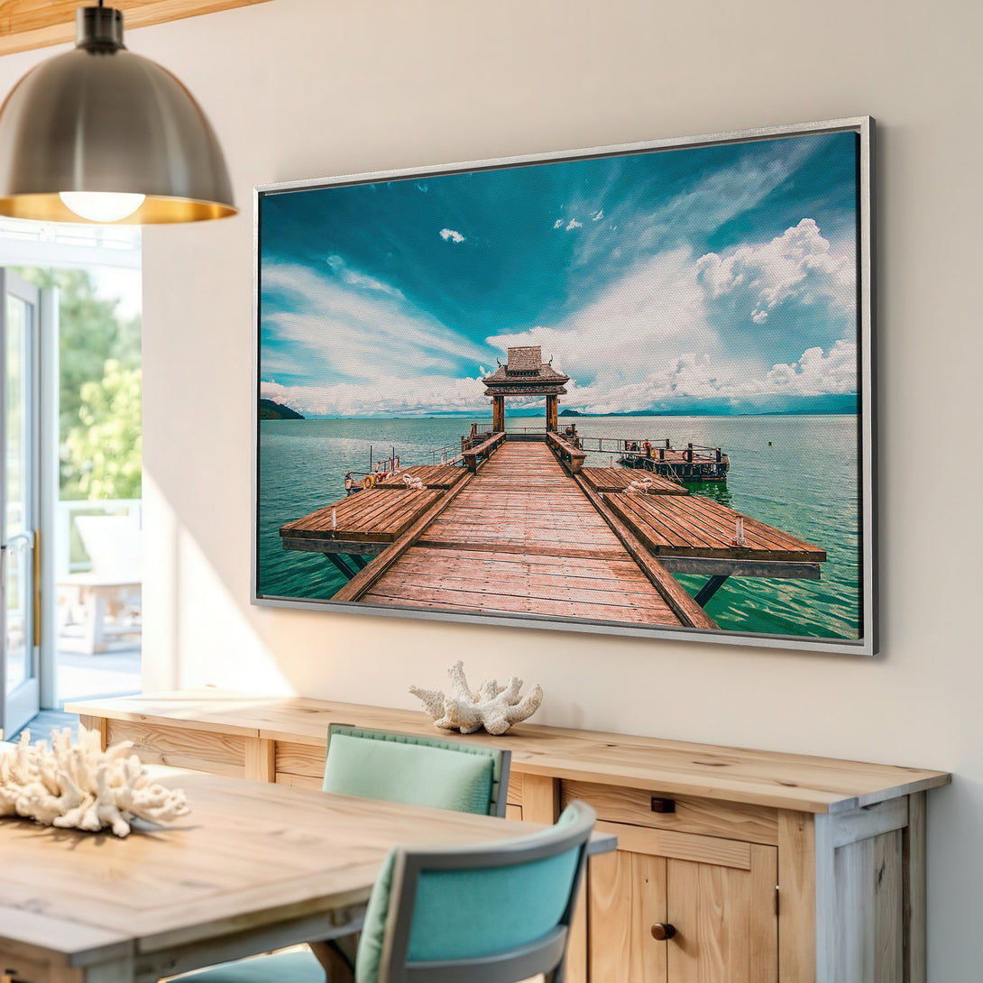 Framed Wall Art: Stunning pier scene Canvas Print with turquoise water, blue skies, and warm wood tones. Perfect for coastal decor!