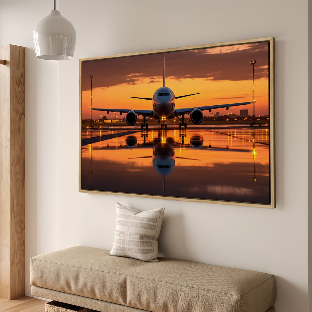 Framed Wall Art: Airplane at sunset. Dramatic, modern art canvas print with warm orange and gold color palette. Perfect for aviation enthusiasts.