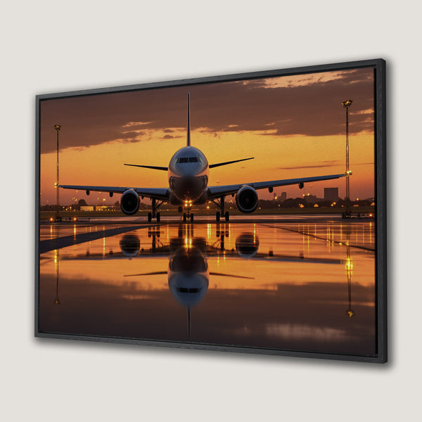 Framed Wall Art: Airplane on runway at sunset. Warm orange and yellow hues create a dramatic, modern aesthetic. Perfect for aviation enthusiasts!