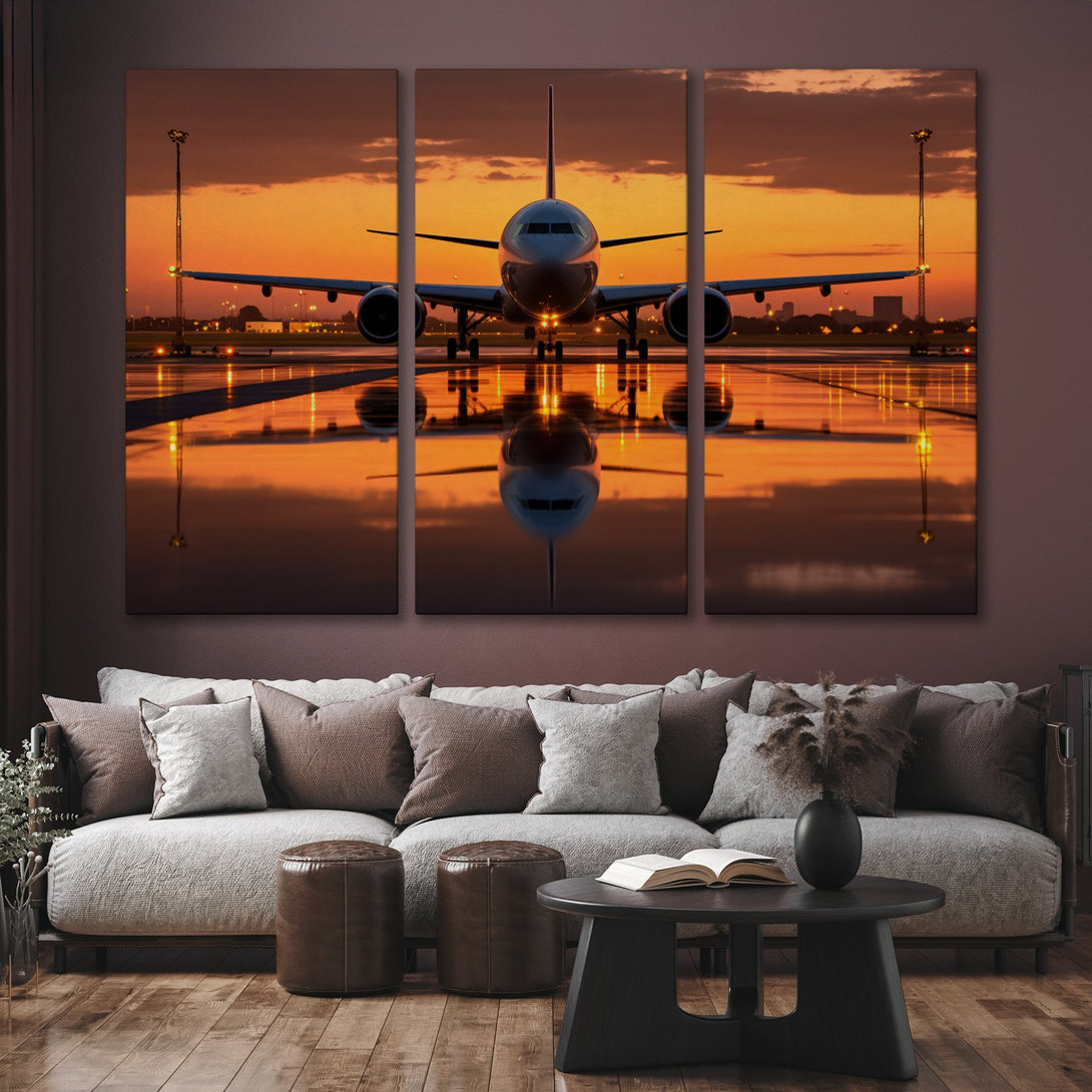 Canvas Print of an airplane at sunset, showcasing a warm orange and gold color palette. Modern wall art for a stylish home.