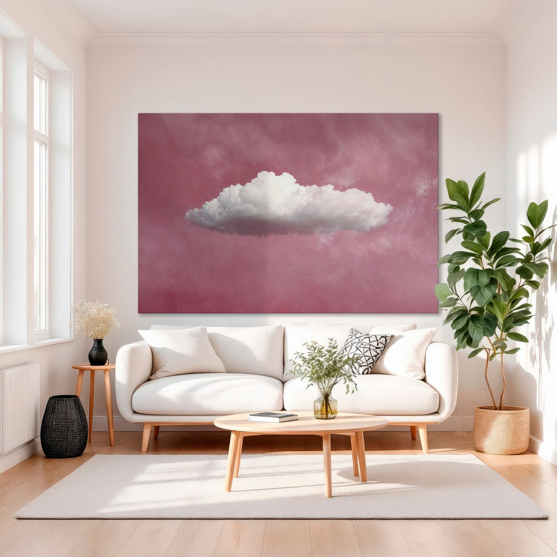 Framed Wall Art featuring a cloud against a pink sky. Modern art piece with gold frame, adding a pop of color to any space.