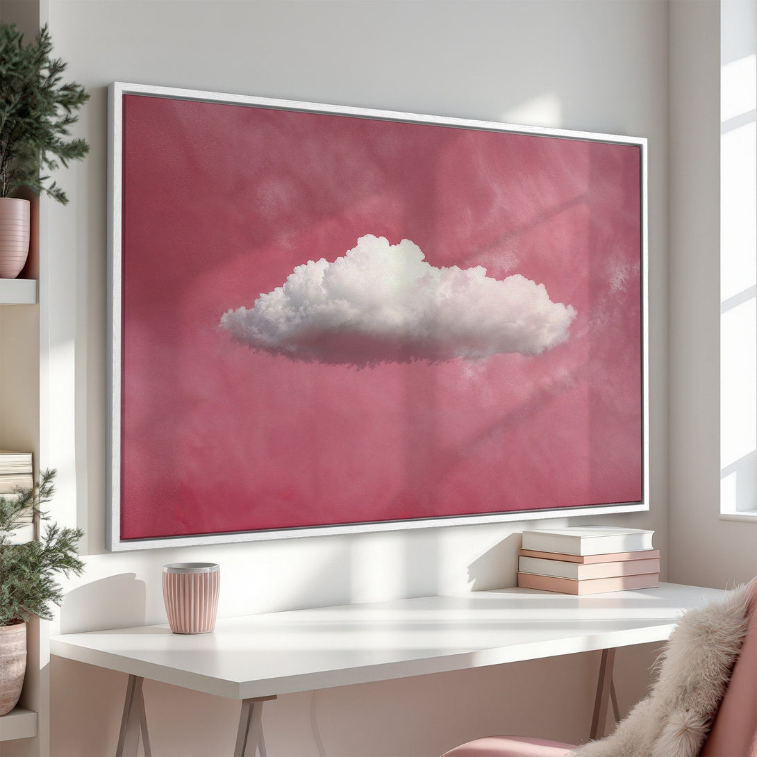 Framed Wall Art featuring a dreamy cloud on a pink background. Modern, minimalist style in a soft, pastel color palette. Perfect for adding a touch of serenity.