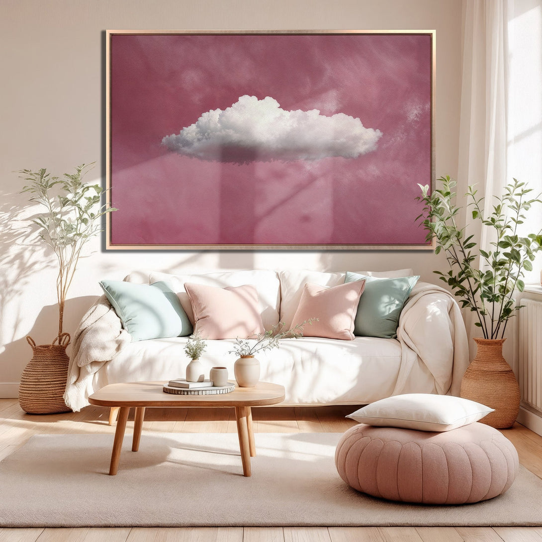 Framed Wall Art featuring a dreamy cloud over a pink sky, perfect for adding a touch of serenity to your home. Soft, pastel color palette.
