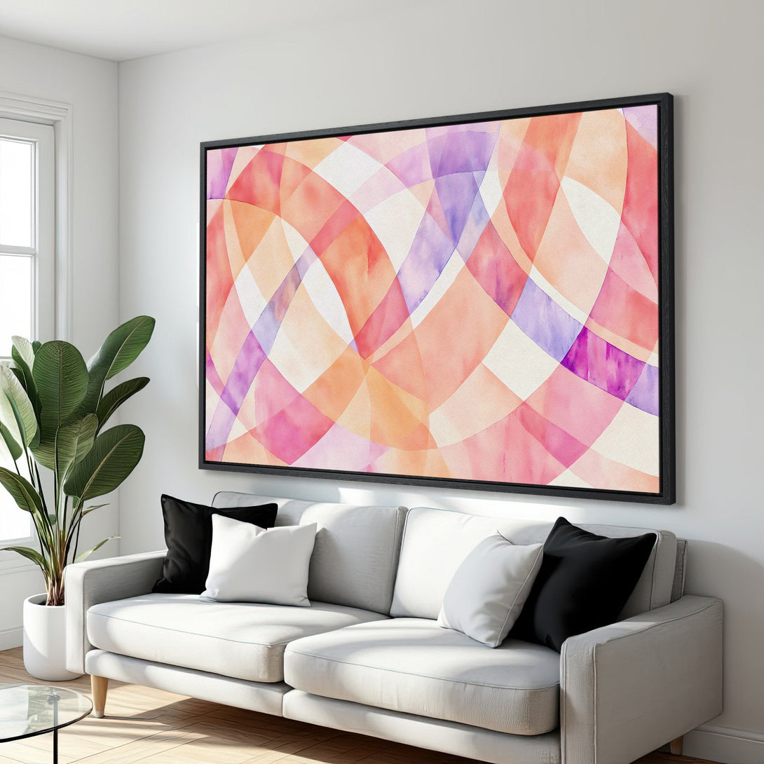 Framed Wall Art featuring an abstract watercolor design in warm pink, orange, and purple hues. Modern art perfect for living room decor.