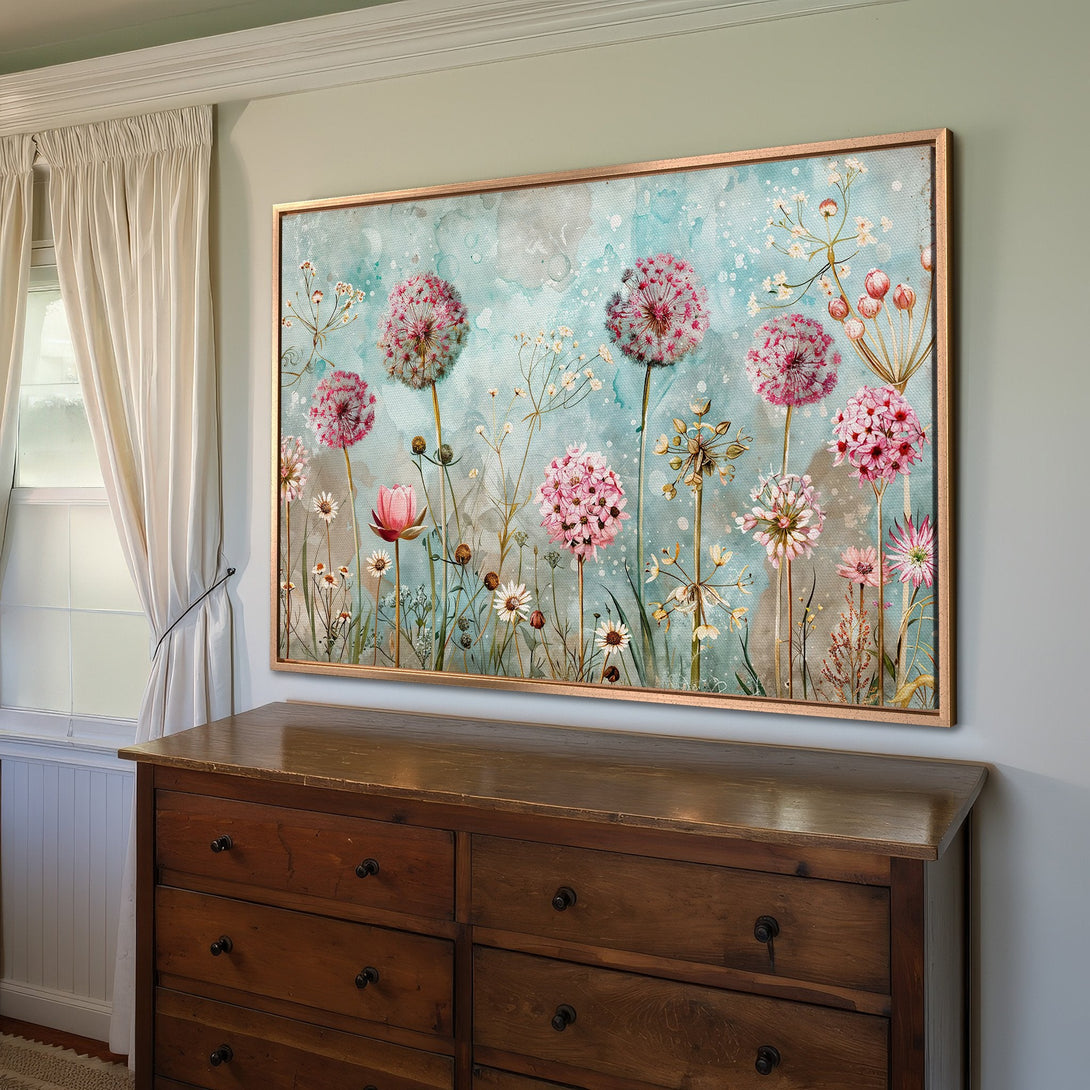 Framed Wall Art featuring a floral watercolor design with pink and blue hues. Adds a touch of elegance to any room.