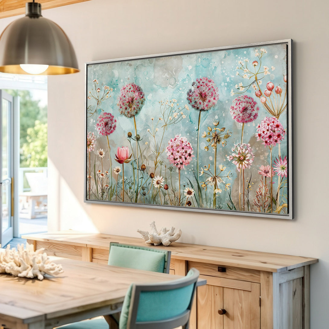 Framed Wall Art: Watercolor floral print in a light blue and pink color palette. Adds a touch of nature-inspired elegance to any space.