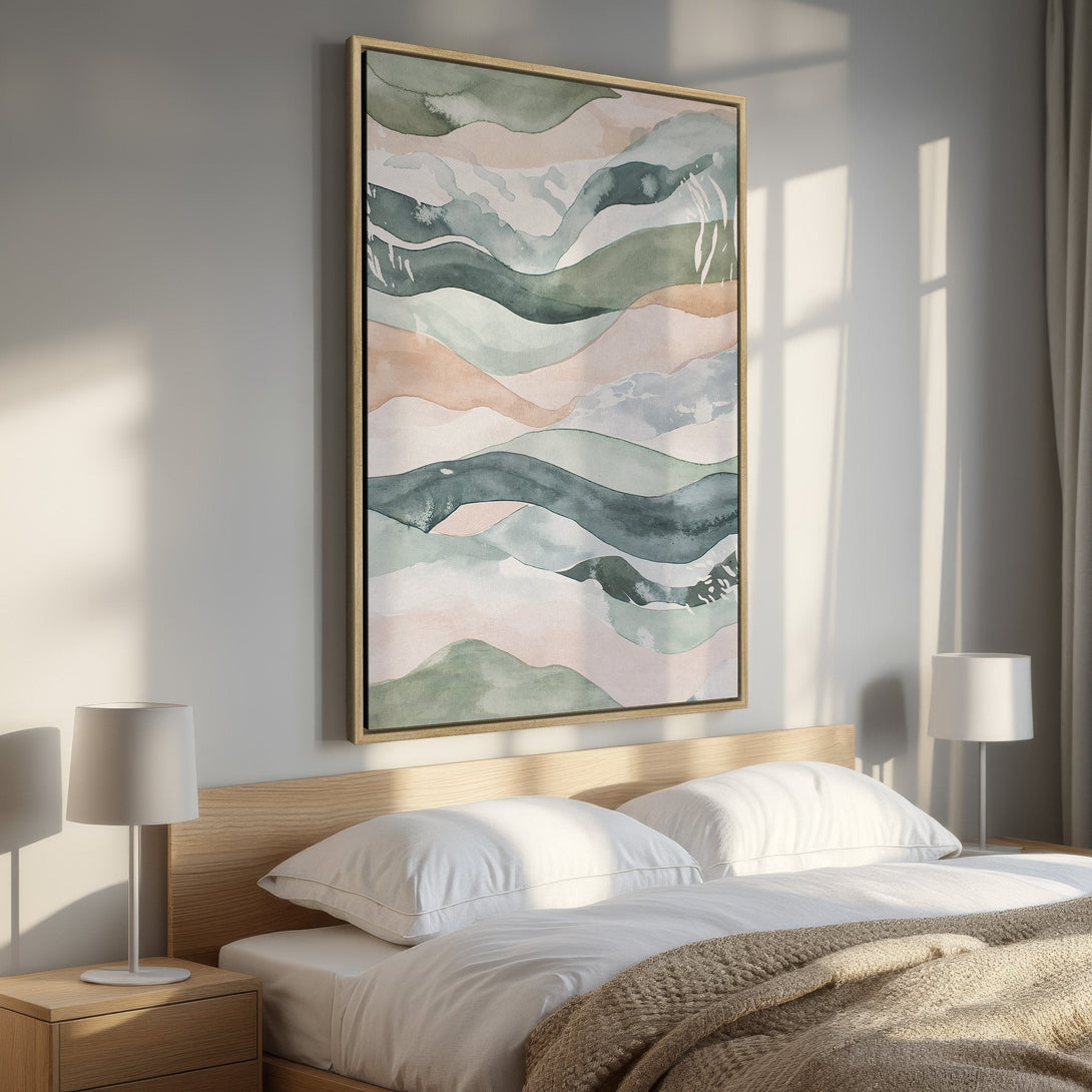Framed Wall Art featuring an abstract watercolor landscape in a serene bedroom. Soft, muted colors of green, pink, and blue create a calming atmosphere.