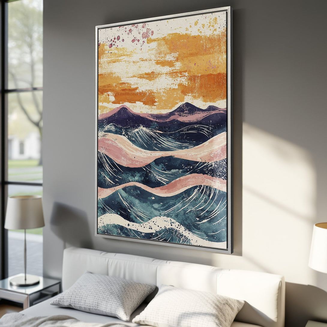 Framed Wall Art: Abstract ocean waves canvas print in a modern bedroom. Features a calming blue, pink, and orange color palette. Elevate your space with this stunning artwork!