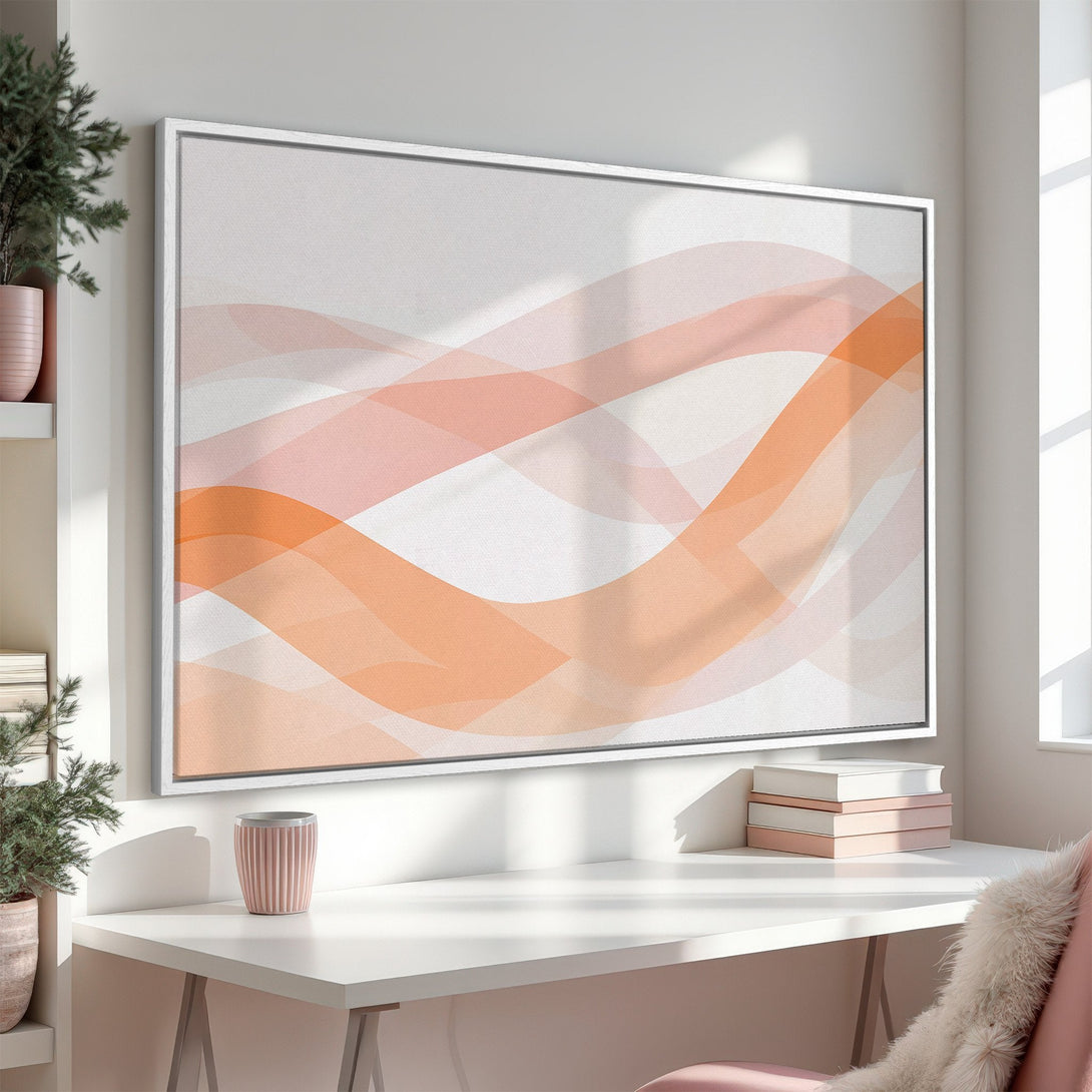 Framed Wall Art: Abstract art canvas print in a modern interior. Features a flowing design in soft peach and white tones. Perfect for adding a touch of elegance.