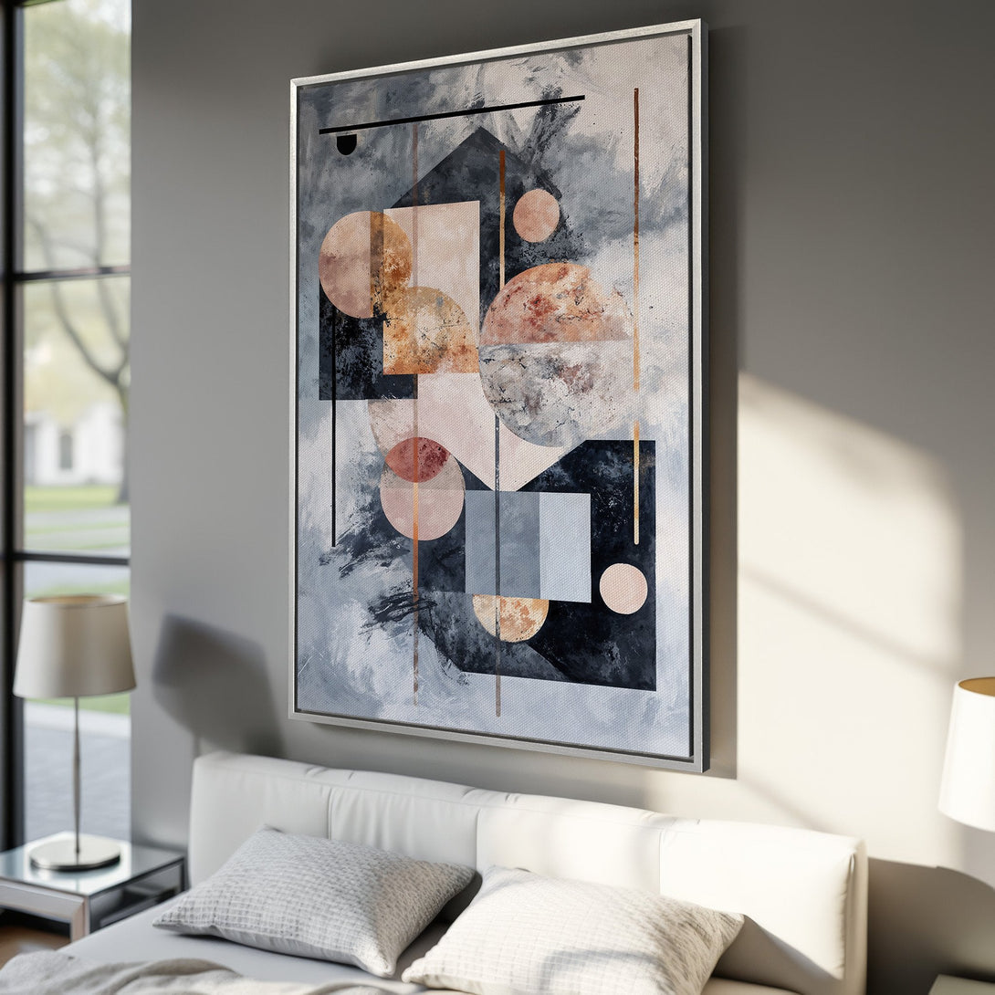Framed Wall Art: Abstract geometric canvas print in a modern interior. Features a muted color palette with gray, black, and blush tones. Perfect for contemporary decor.