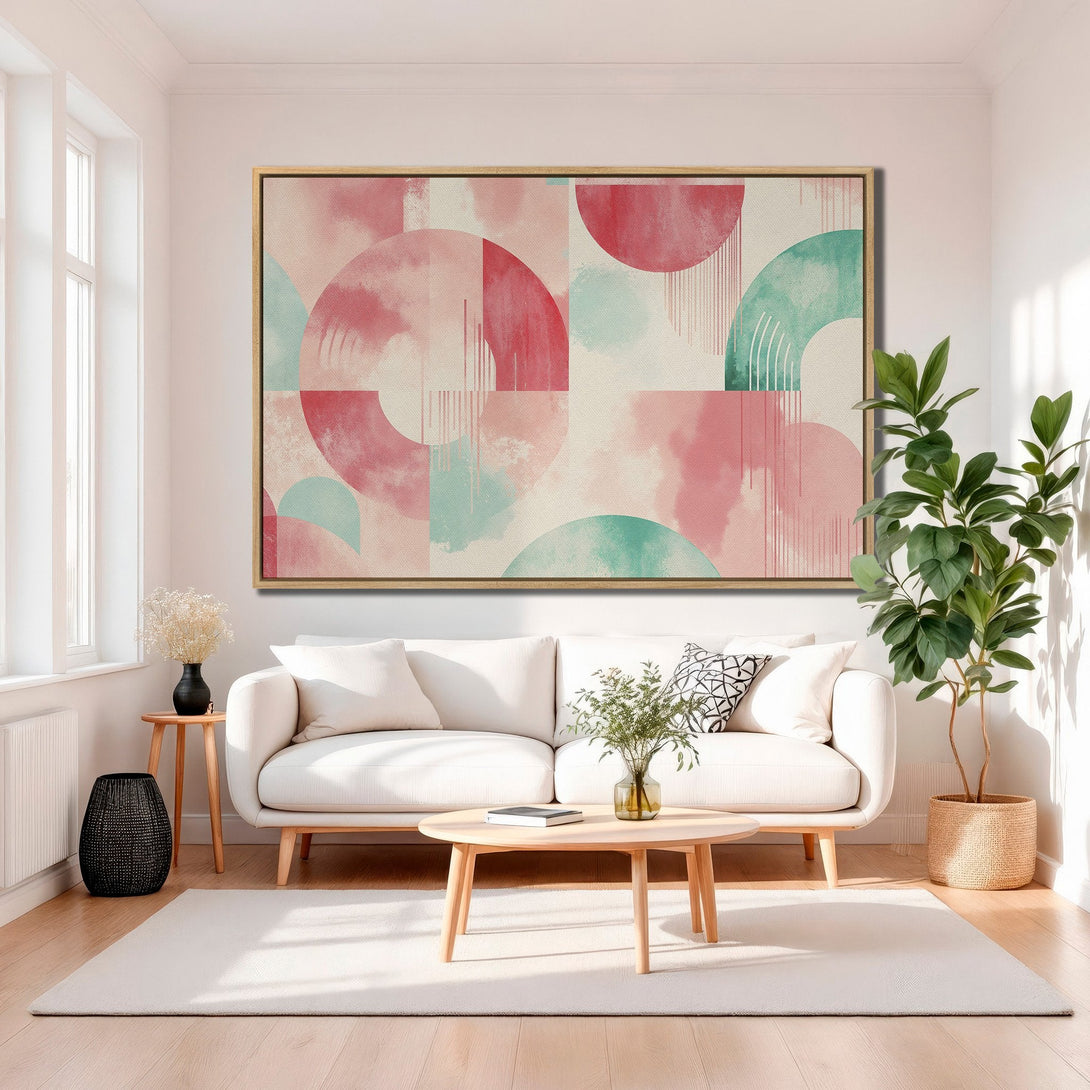 Framed Wall Art featuring abstract geometric design in pink & teal hues. Modern canvas print adds a pop of color to any living room. Shop now!