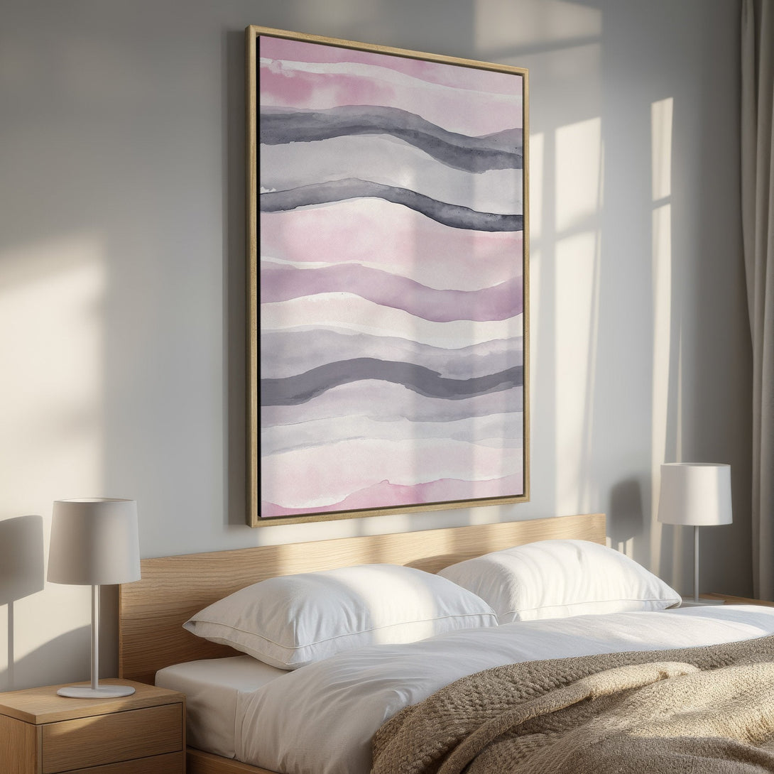 Framed Wall Art Canvas Print in a bedroom. Abstract watercolor waves in pink, gray, and white. Modern art for a calming interior.
