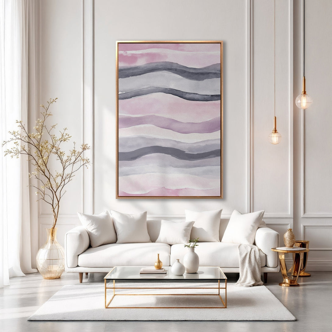 Framed Wall Art: Abstract watercolor waves in pink and gray, displayed in a modern living room. Elevate your space with this elegant canvas print!