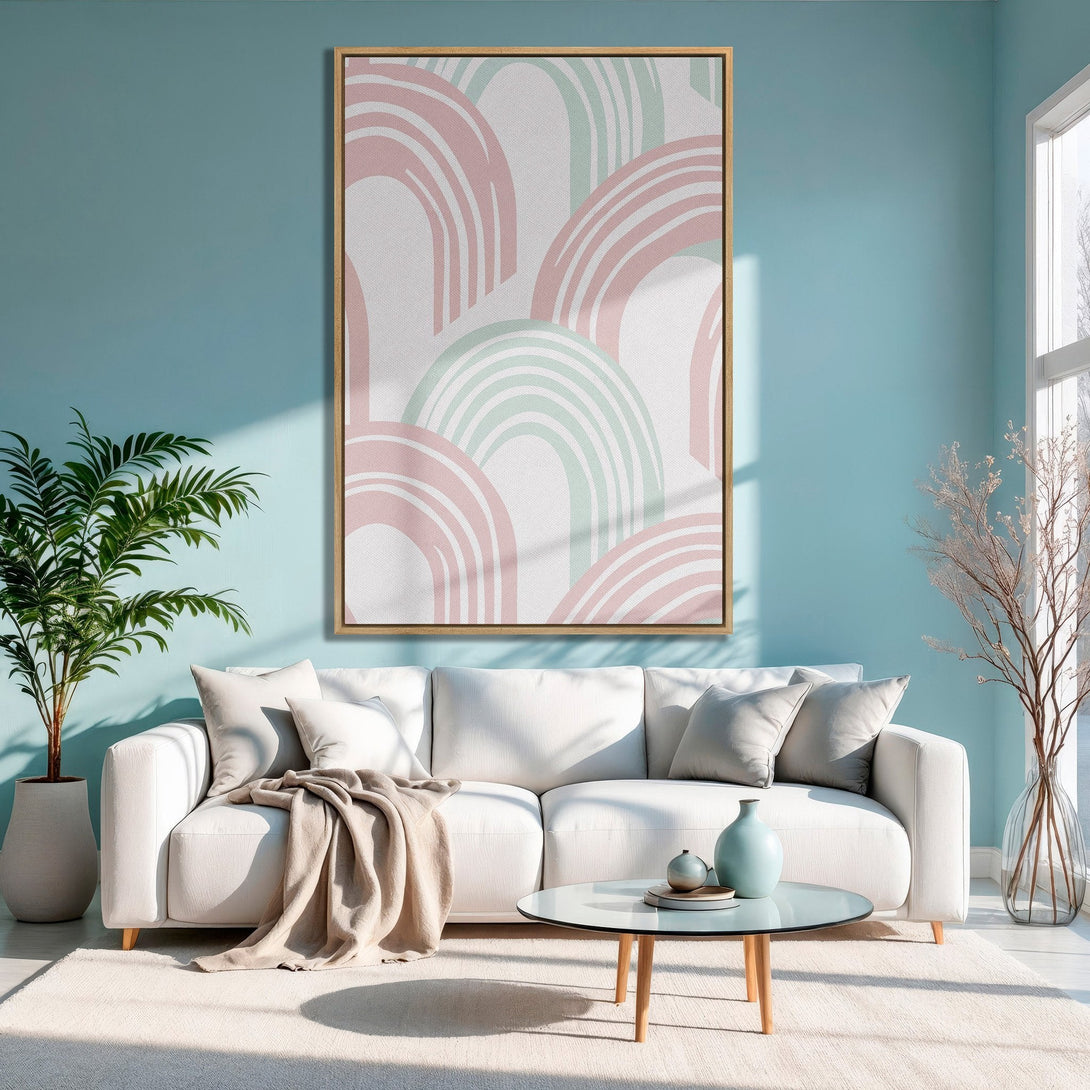 Framed Wall Art featuring abstract arch design in blush pink and mint green. Modern Canvas Print adds a pop of color to a serene living room.
