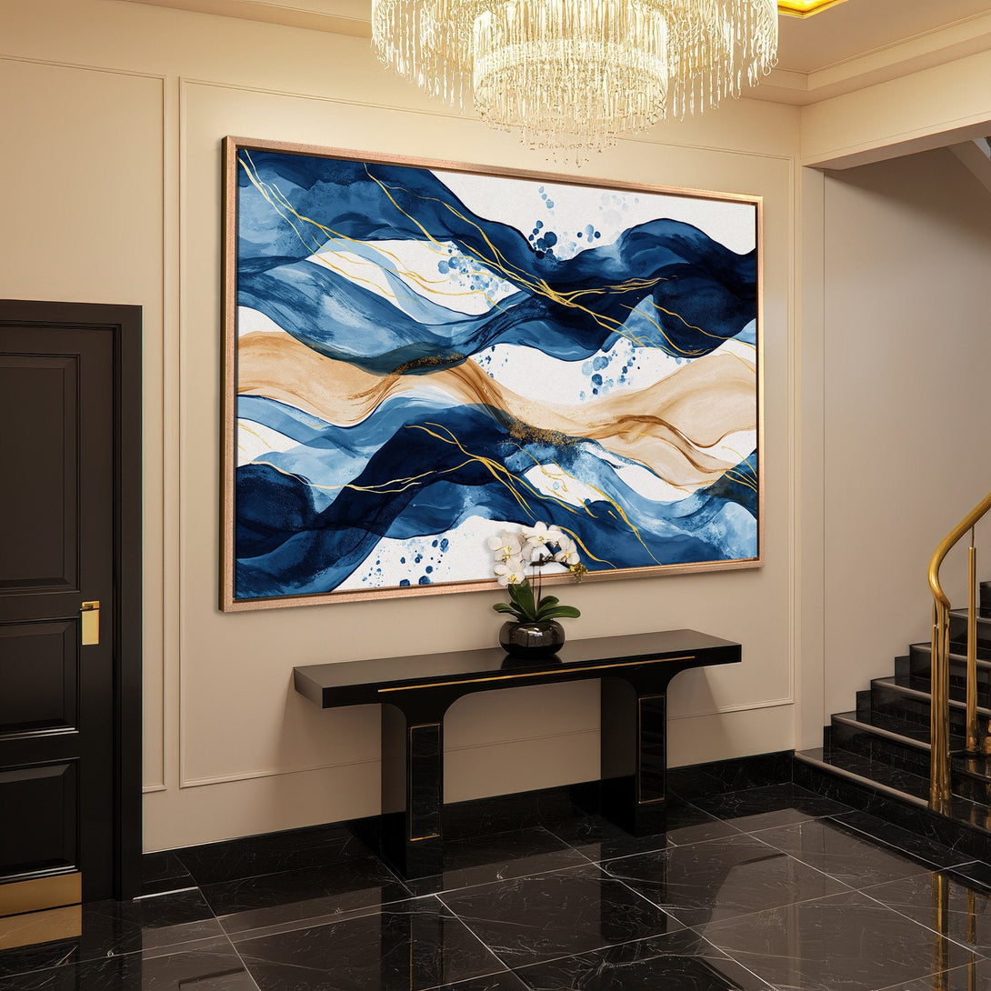 Framed Wall Art: Abstract blue & gold canvas print adds elegance to entryway. Modern art with a calming, sophisticated color palette.