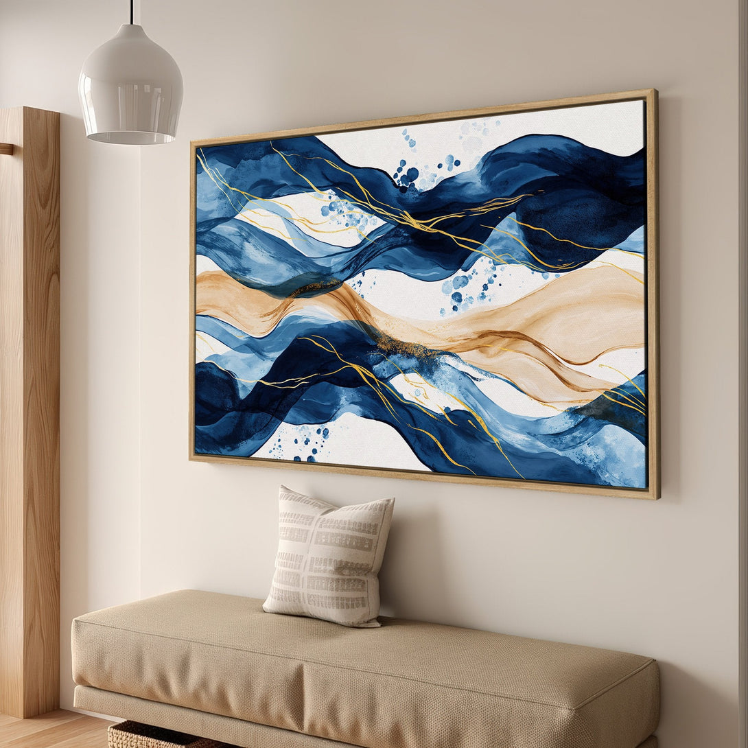 Framed Wall Art featuring abstract blue and gold waves. Modern watercolor style canvas print adds elegance to any interior. Shop now!