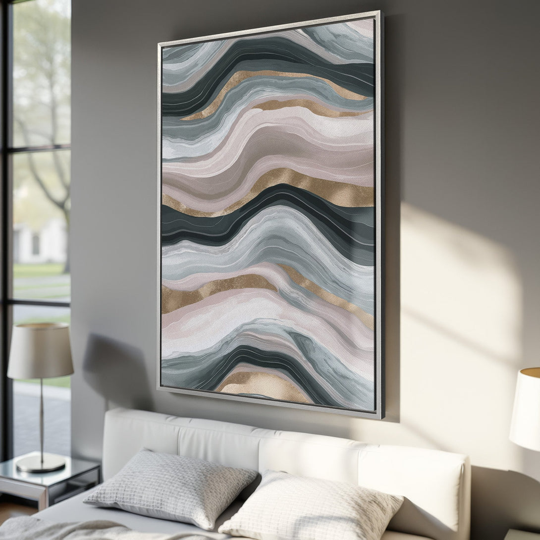 Framed Wall Art showcasing an abstract, flowing design in muted tones of gray, pink, and gold. Perfect for adding a touch of modern elegance to any space.
