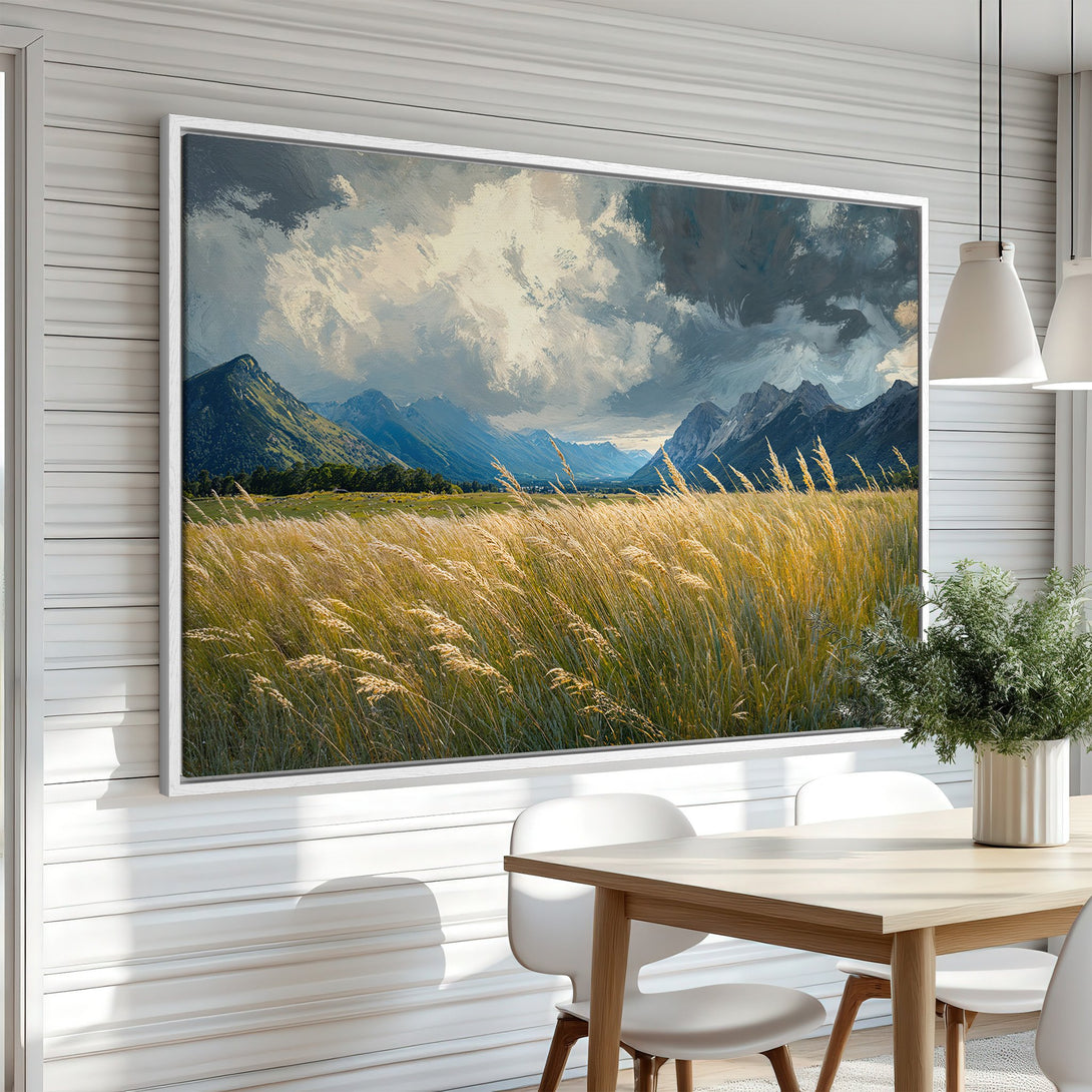 Framed Wall Art featuring a landscape painting of mountains and golden fields. Neutral color palette adds a touch of serenity to any room.