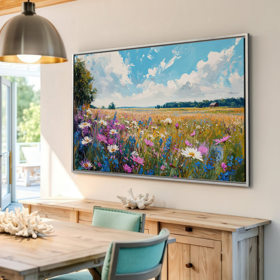 Framed Wall Art: Impressionist field of wildflowers in a vibrant blue, pink, and yellow palette. Perfect for adding a touch of nature to your home decor.