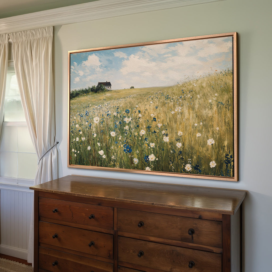 Framed Wall Art: Impressionist landscape Canvas Print with wildflowers in a field. Earthy tones with blue and white accents. Perfect for a cozy interior.