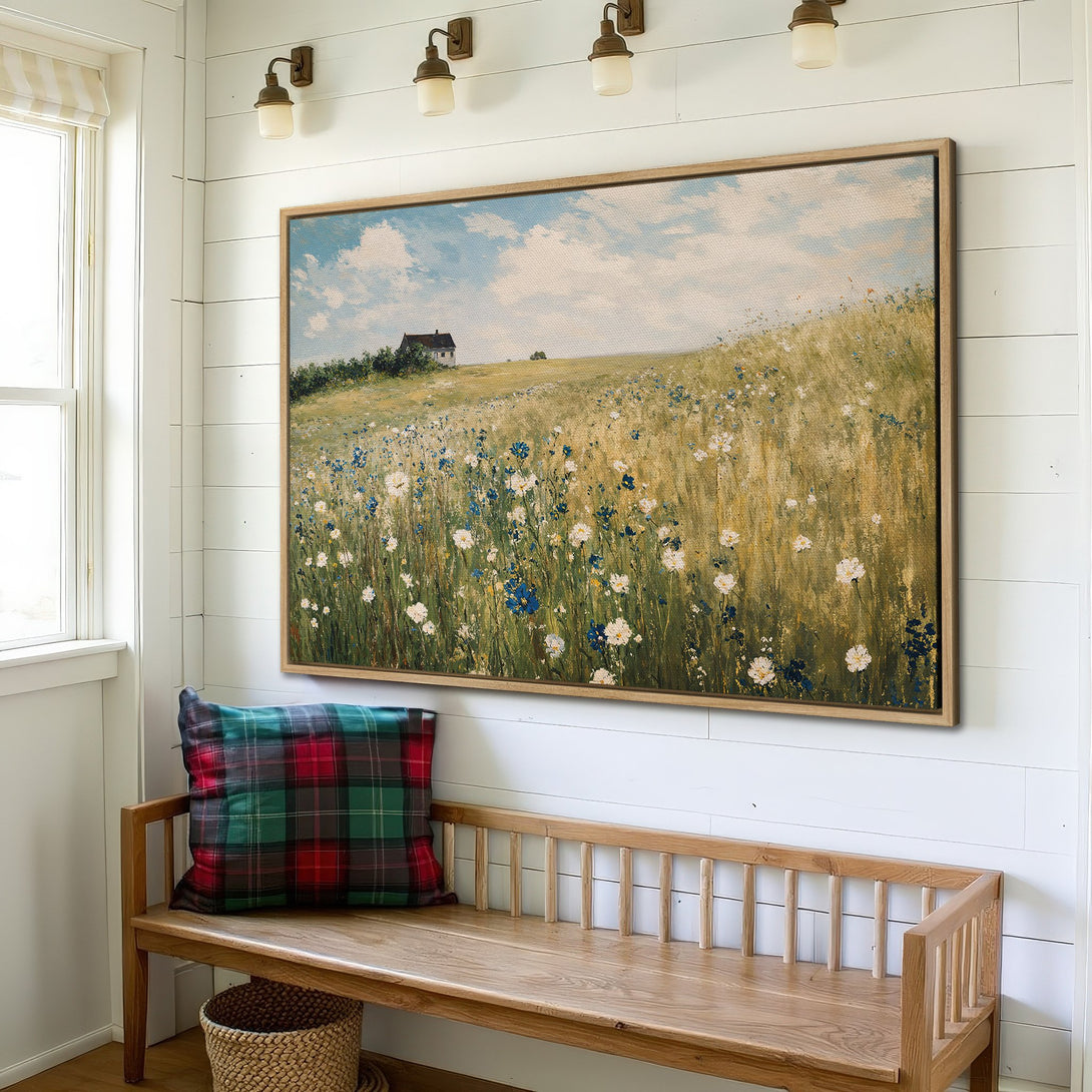 Framed Wall Art featuring a serene field scene with a cottage. Warm, neutral color palette. Perfect for adding a touch of nature to your home.