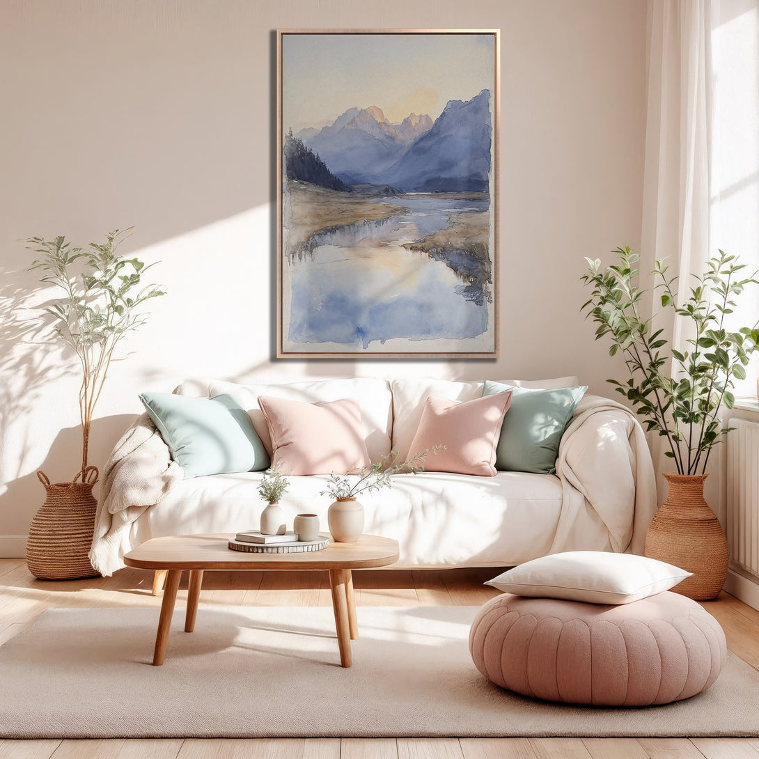 Framed Wall Art of watercolor landscape in a modern living room. Soft blue, beige, and pink color palette for a calming interior.