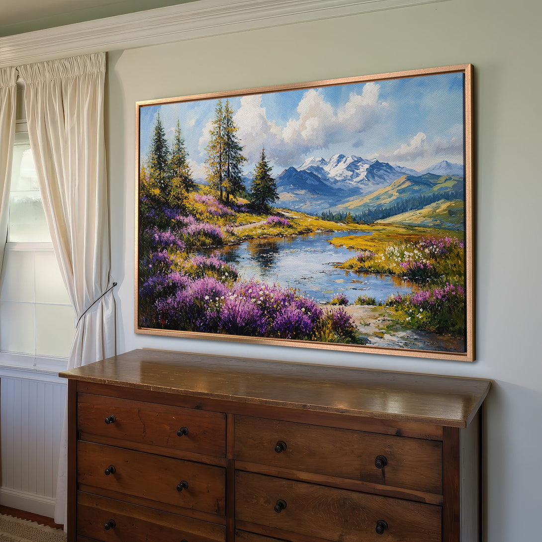 Framed Wall Art: Landscape painting with mountains, lake, and wildflowers. Warm color palette with blues, greens, and purples. Perfect for home decor.