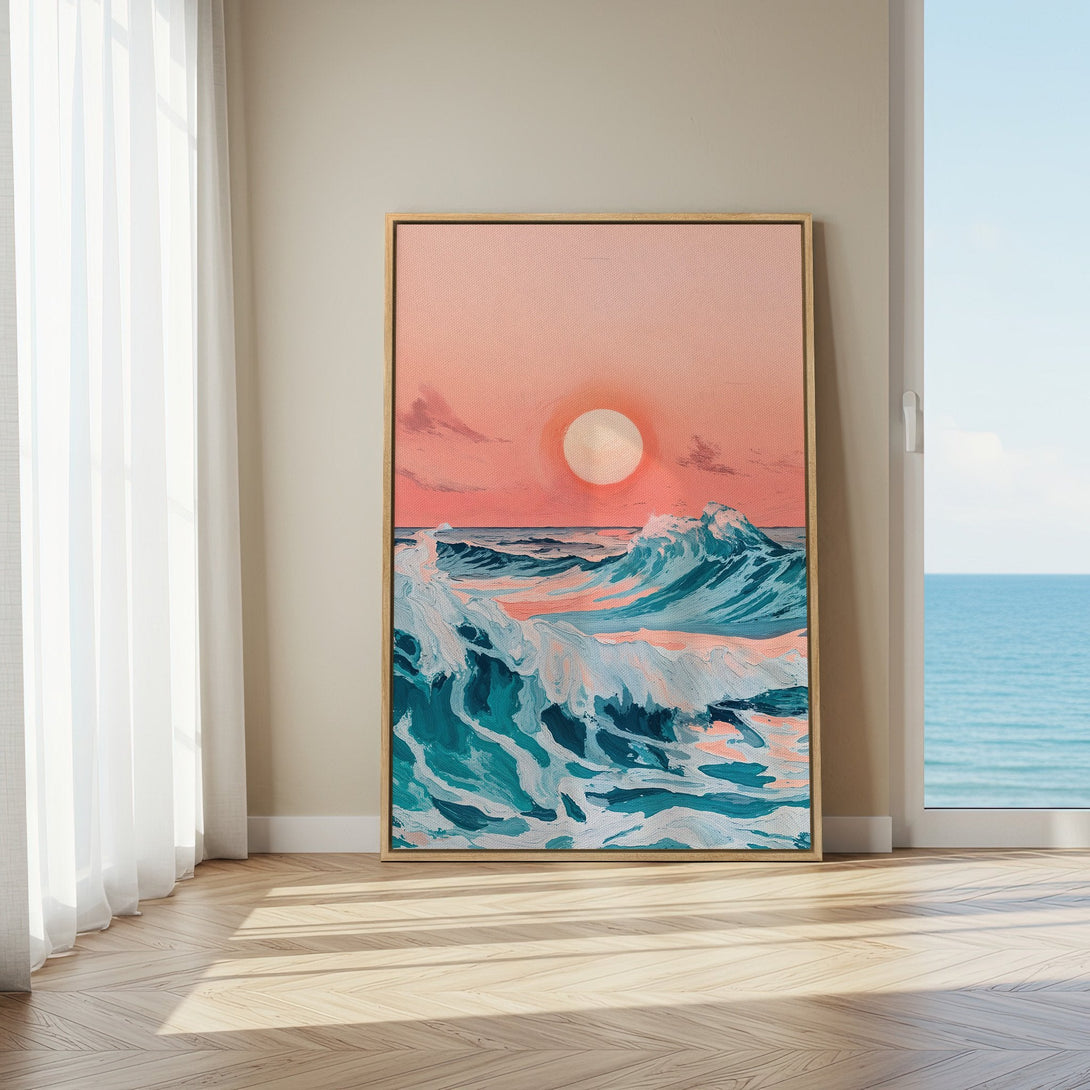 Framed Wall Art: Coastal sunset canvas print in a modern interior. Features ocean waves in teal & pink, perfect for adding a touch of serenity to your space.