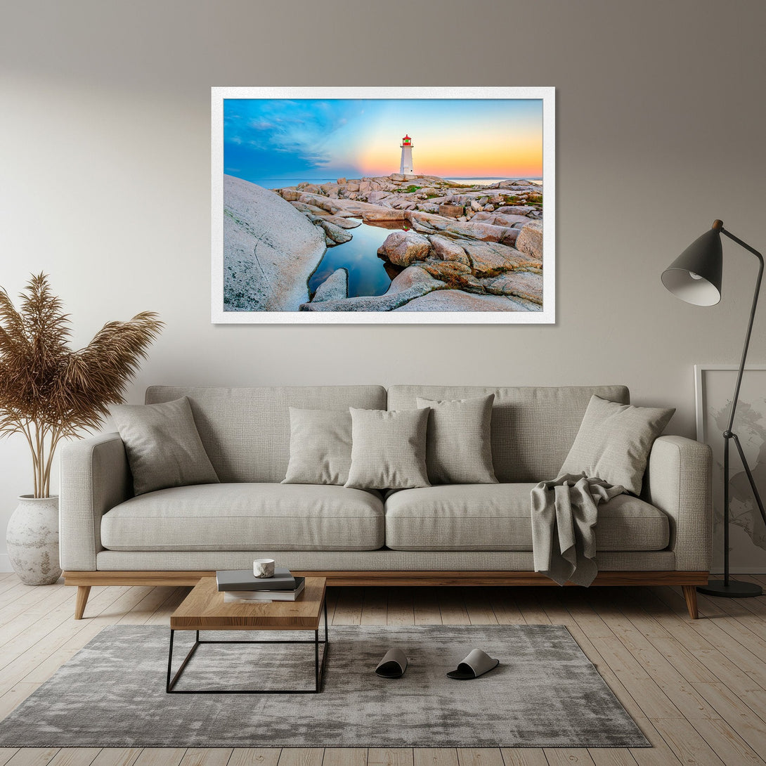 Framed Poster featuring a lighthouse landscape in a vibrant sunset palette. Coastal art for a serene home.