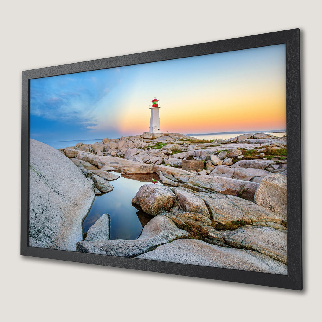 Framed Poster featuring a lighthouse at sunset. Coastal landscape art with warm orange, blue, and gray tones. Bring the beauty of nature home!