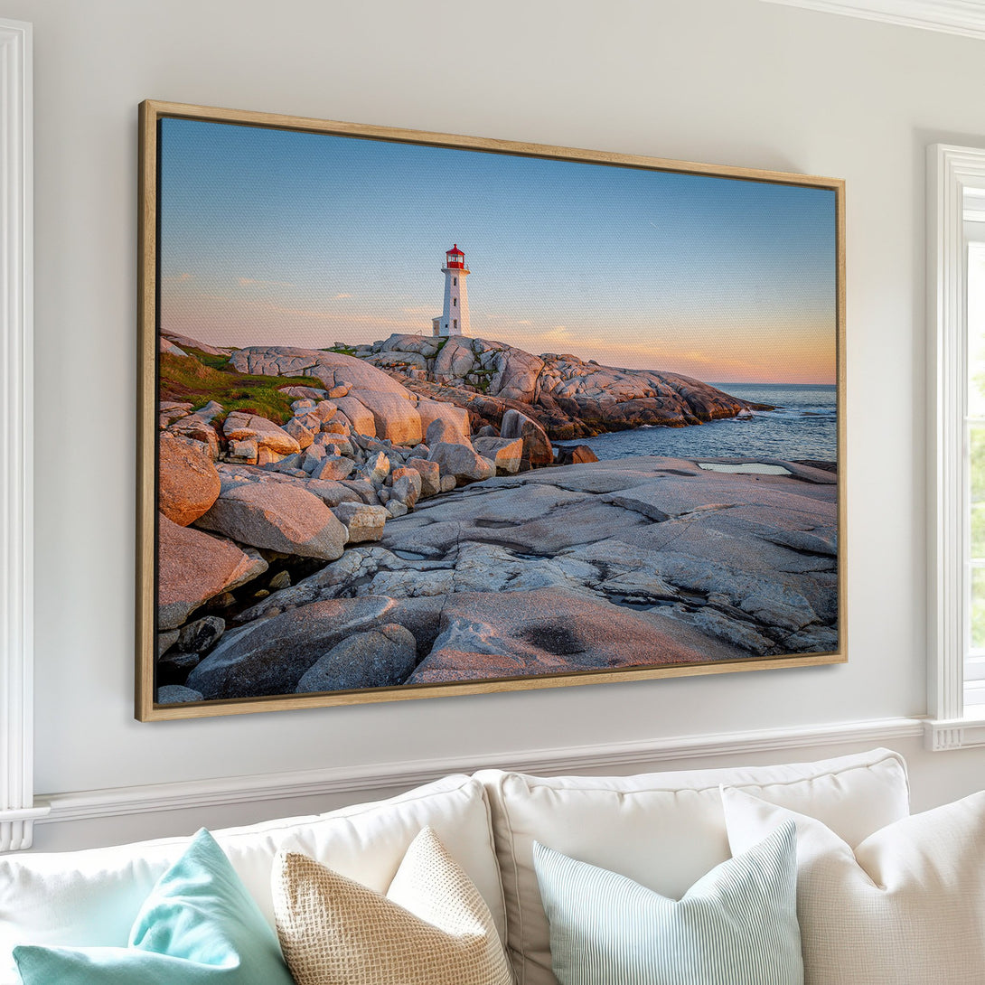 Framed Wall Art of a lighthouse at sunset. Coastal landscape Canvas Print featuring a serene color palette of blues, oranges, and grays. Perfect home decor.