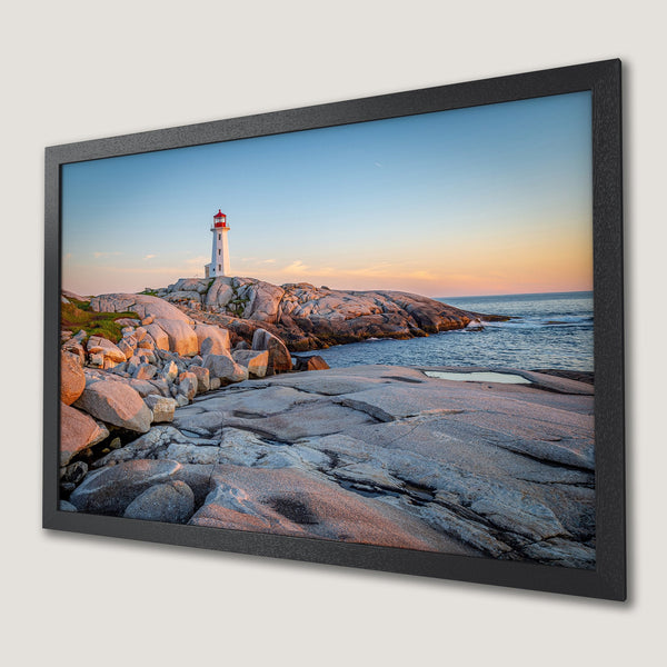 Framed Poster of a lighthouse on rocky coast. Coastal landscape art in a warm, natural color palette. Perfect wall decor.