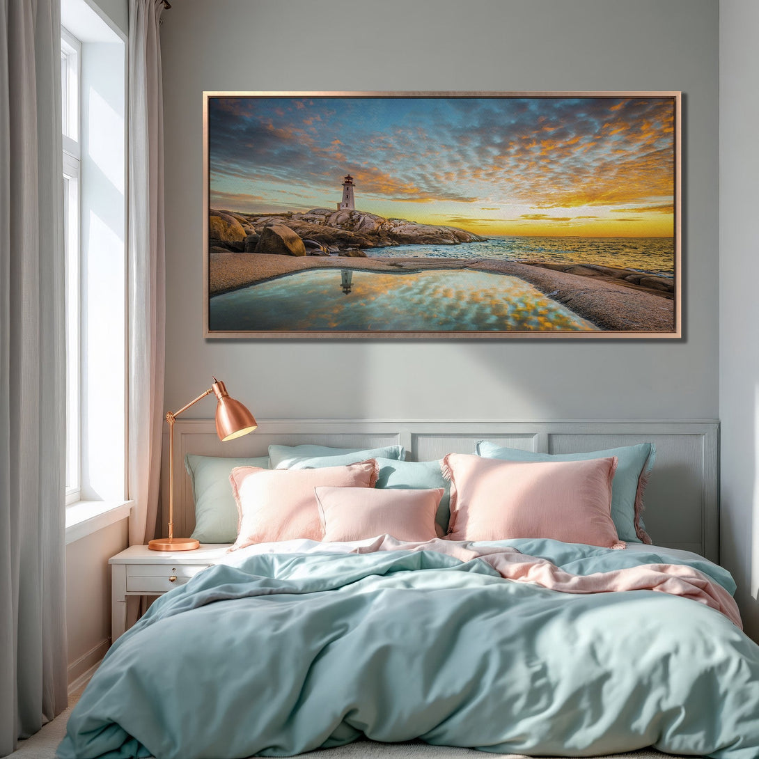 Framed Wall Art: Lighthouse sunset canvas print in a bedroom. Coastal landscape with vibrant blues, oranges, and golden hues. Perfect for a calming interior.