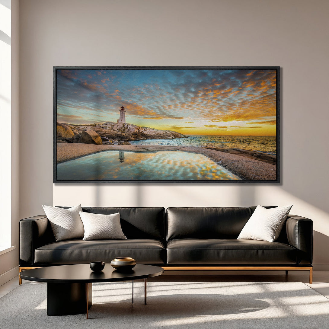 Framed Wall Art of a lighthouse at sunset. Coastal landscape art in vibrant orange, blue, and yellow tones. Perfect for living room decor.