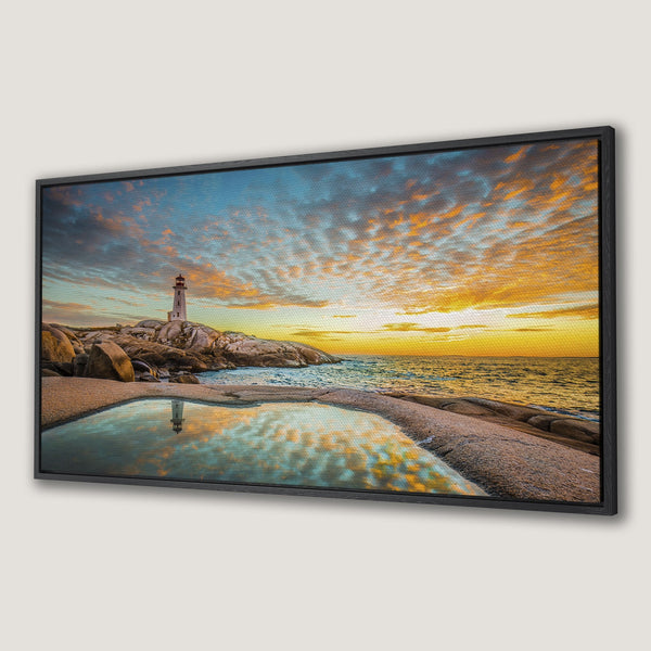 Framed Wall Art of a lighthouse at sunset. Coastal landscape art with warm orange, blue, and yellow color palette. Perfect wall decor for any space.