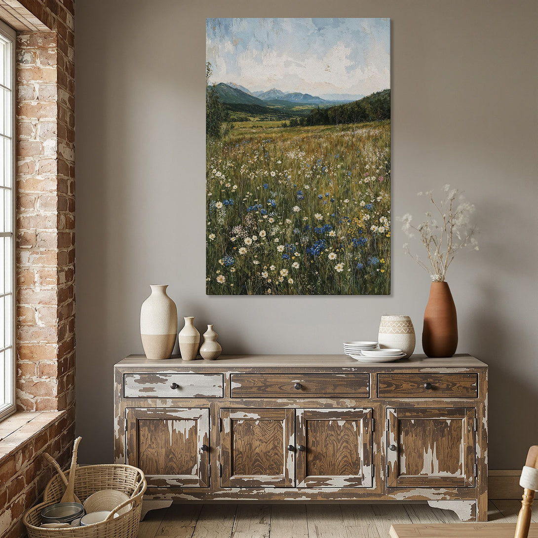 Framed Wall Art: Landscape Canvas Print with wildflowers, mountains, and a blue sky. Warm, inviting color palette for a cozy dining room.