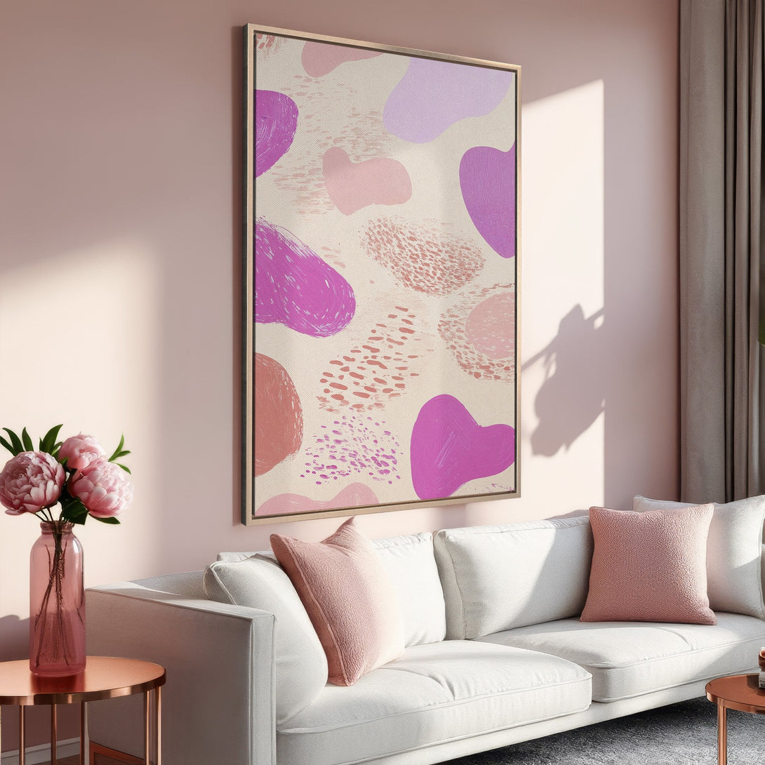 Framed Wall Art featuring abstract shapes in pink and purple hues. Modern canvas print adds a pop of color to any living room. Shop now!