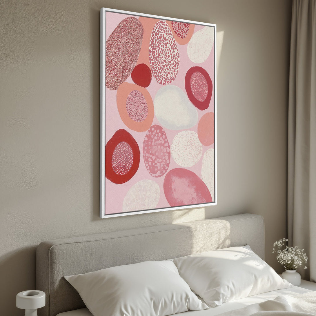 Framed Wall Art: Abstract pink and red shapes on a canvas. Modern art for bedroom decor, featuring a calming color palette.